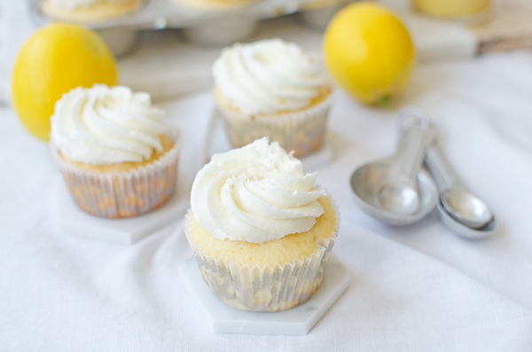 Great idea! Recipe for vanilla cupcakes stuffed with lemon curd and topped with lemon buttercream!